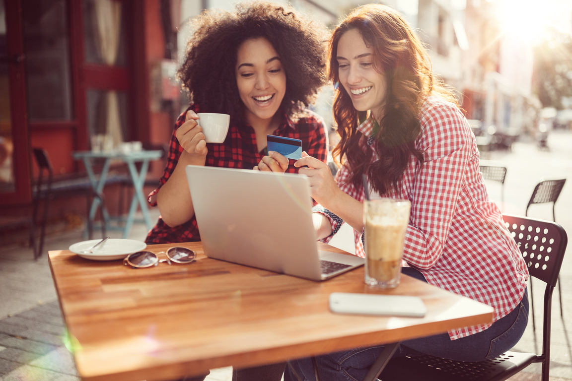 Girls drinking coffee and shopping online